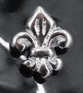 Fleur-de-lis emblem for harness
